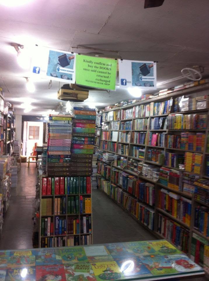 A nostalgic view down the Maneesh Book Shop aisle lined with books